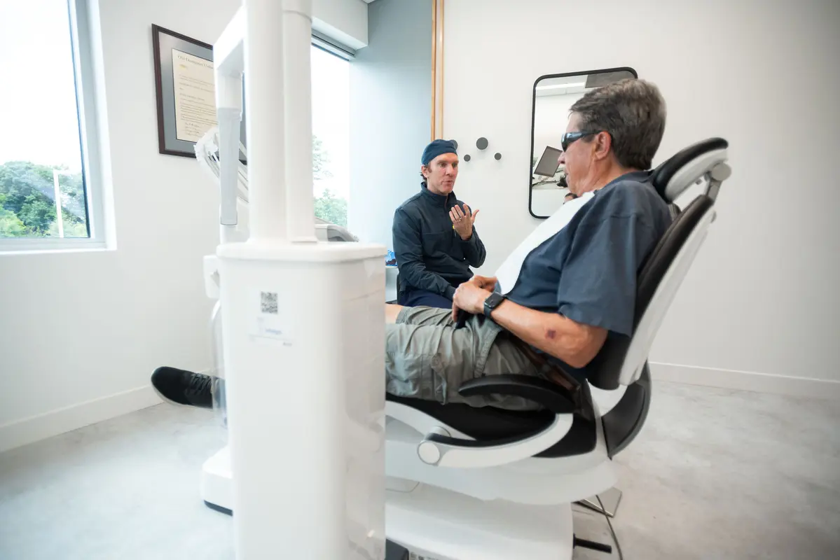 Dr. Forbes consulting with a patient
